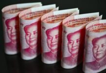 Yuan Slips Against Dollar As China’s Central Bank Sets Weaker Exchange Rate Yuan